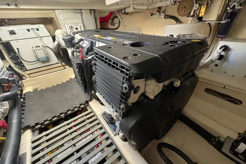 Slide: The Image of Engine room of 2016 Tiara Yachts C44 Coupe, showcasing detailed mechanical components. - 74