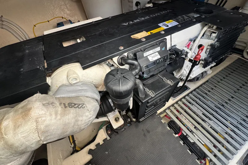 Slide: The Image of Engine compartment of a 2016 Tiara Yachts C44 Coupe, featuring a Volvo Penta engine. - 77