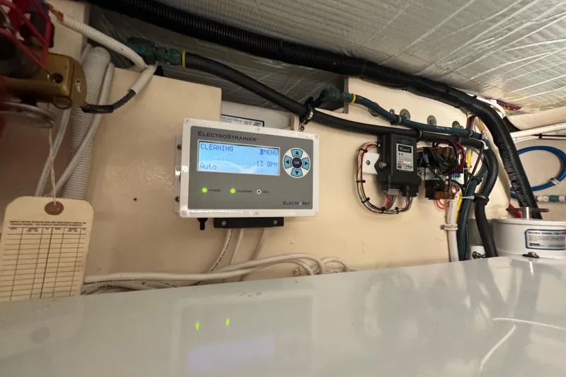 Slide: The Image of Control panel in 2016 Tiara Yachts C44 Coupe engine room, displaying cleaning status. - 78