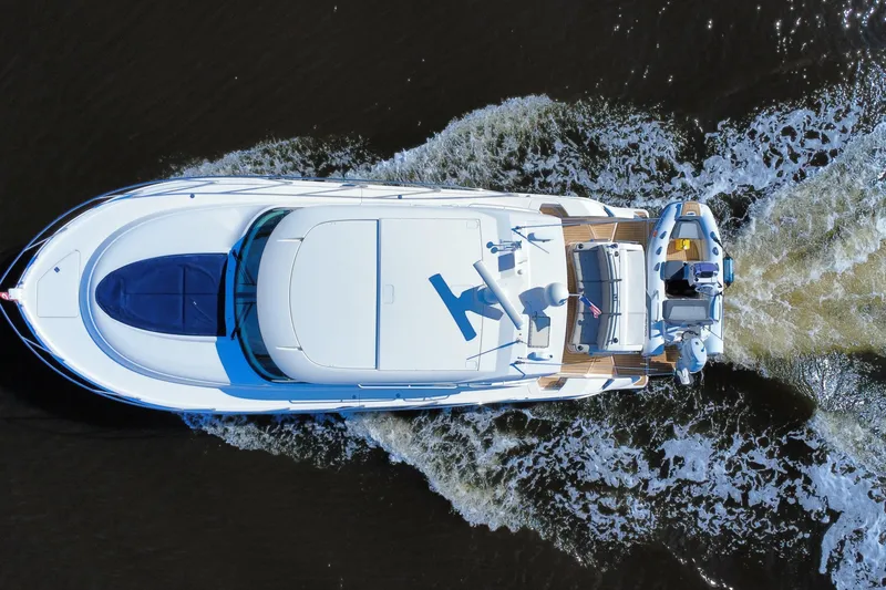Slide: The Image of Overhead view of 2016 Tiara Yachts C44 Coupe cruising on water. - 8