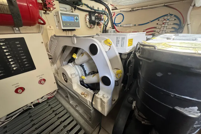 Slide: The Image of Engine room of 2016 Tiara Yachts C44 Coupe with mechanical components and control panels. - 82