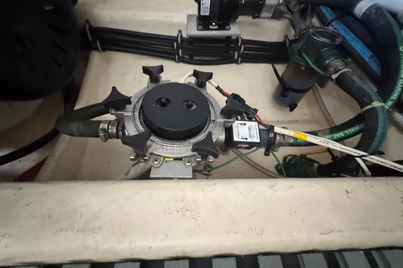 Slide: The Image of Engine compartment of 2016 Tiara Yachts C44 Coupe with visible mechanical components. - 84