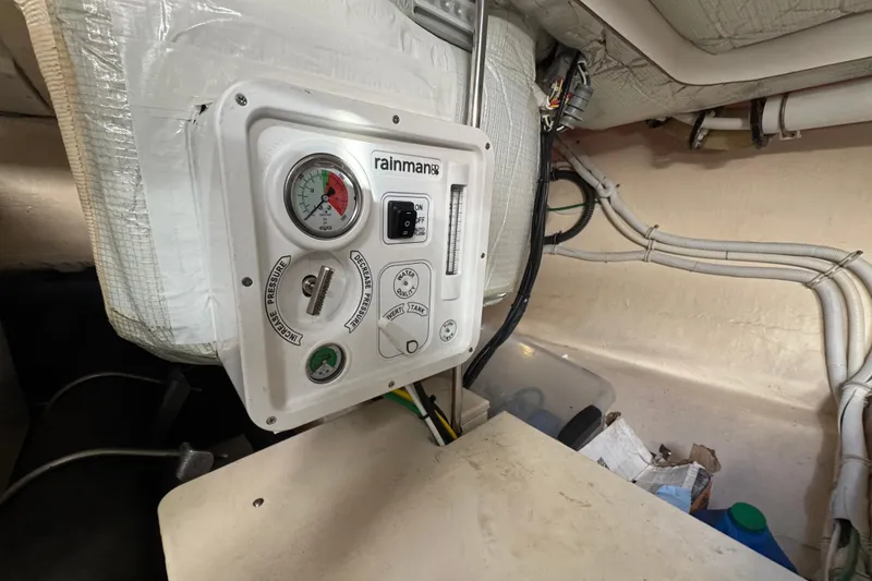 Slide: The Image of Control panel in 2016 Tiara Yachts C44 Coupe engine room, featuring gauges and switches. - 87