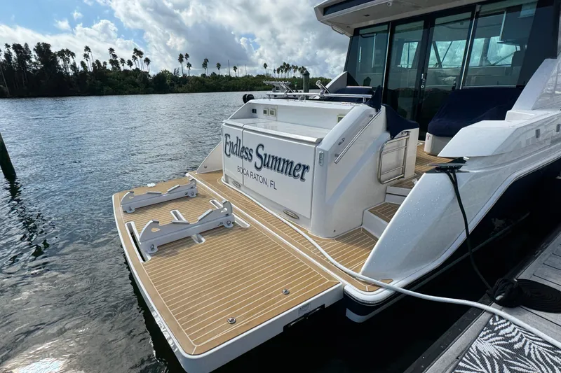 Slide: The Image of 2016 Tiara Yachts C44 Coupe docked, featuring "Endless Summer" nameplate, Boca Raton, FL. - 90
