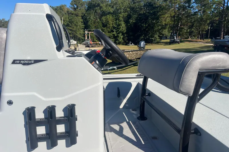 Slide: The Image of Avid 18 Rogue CC 2026 boat interior with steering console and seating. - 10