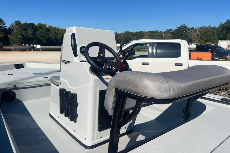 Slide: The Image of Avid 18 Rogue CC 2026 boat interior with steering console and seating. - 11