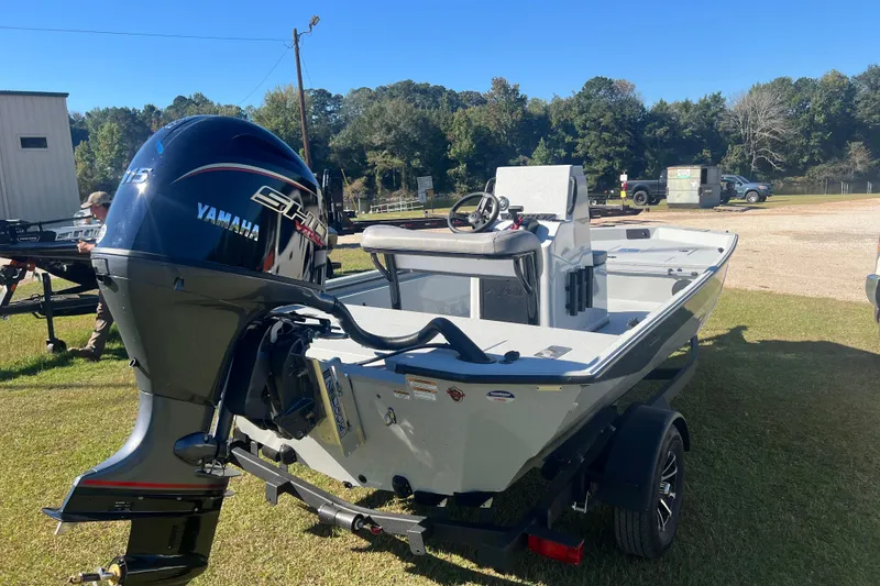 Slide: The Image of 2026 Avid 18 Rogue CC boat with Yamaha engine on trailer, outdoors. - 4