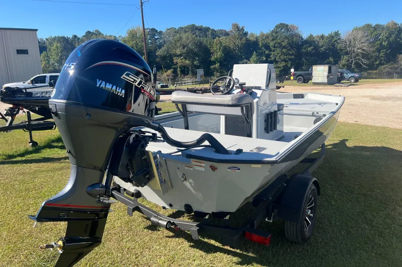 Slide: The Image of Avid 18 Rogue CC 2026 boat with Yamaha engine on grassy area. - 5