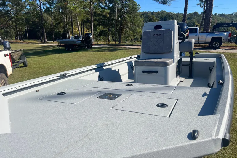 Slide: The Image of 2026 Avid 18 Rogue CC boat on grass, featuring spacious deck and seating. - 8