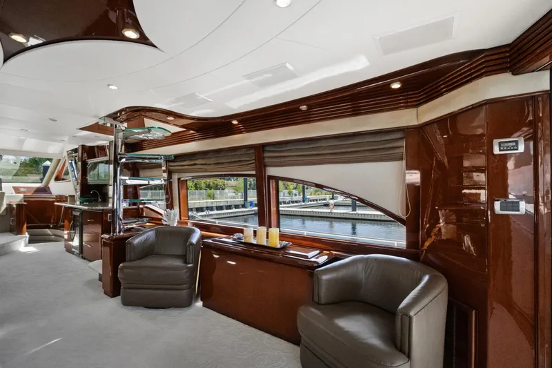 Slide: The Image of Luxurious interior of a 2008 Marquis 690 yacht with elegant seating and polished wood finishes. - 10