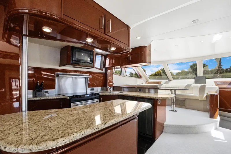 Slide: The Image of Luxurious 2008 Marquis 690 yacht interior with modern kitchen and panoramic windows. - 12