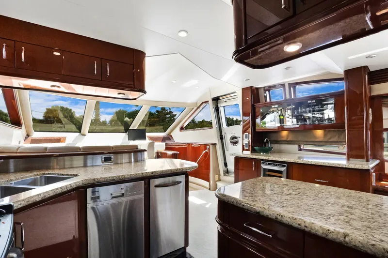 Slide: The Image of Luxurious interior of 2008 Marquis 690 yacht with modern kitchen and panoramic windows. - 16