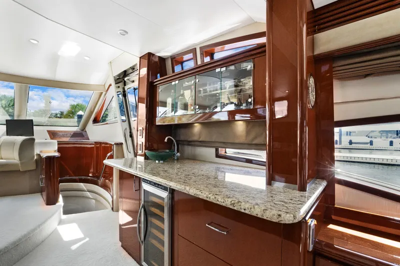Slide: The Image of Luxurious interior of 2008 Marquis 690 yacht with modern kitchen and elegant seating area. - 17