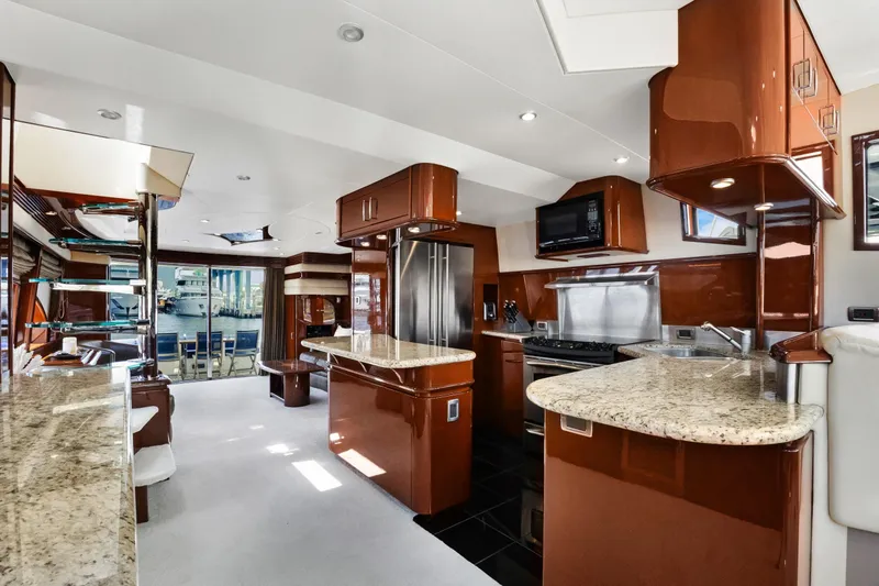 Slide: The Image of Luxurious interior of a 2008 Marquis 690 yacht with modern kitchen and elegant design. - 20