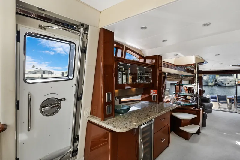 Slide: The Image of Luxurious interior of 2008 Marquis 690 yacht with modern kitchen and waterfront view. - 21