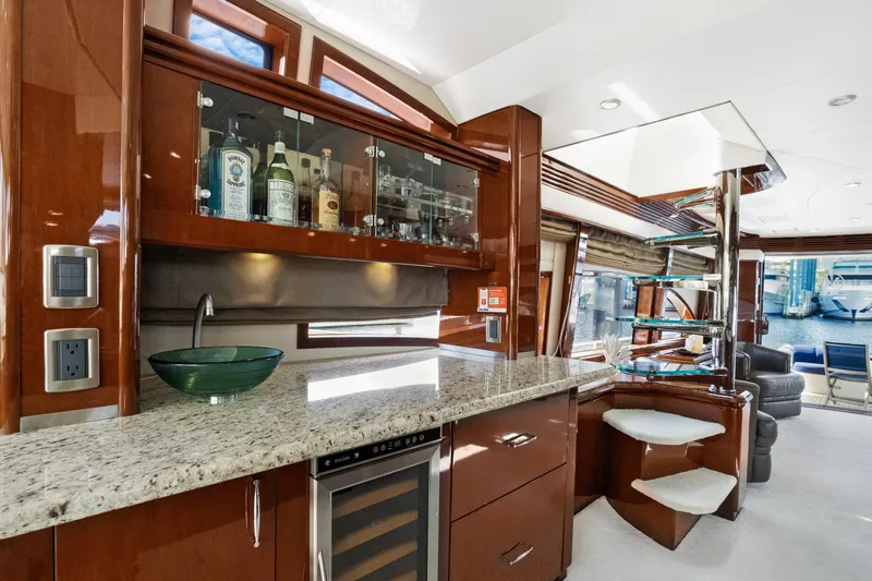 Slide: The Image of Luxurious 2008 Marquis 690 yacht interior with elegant bar and modern amenities. - 22