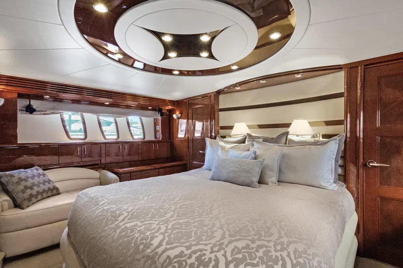 Slide: The Image of Luxurious bedroom interior of 2008 Marquis 690 yacht with elegant wood finishes. - 26