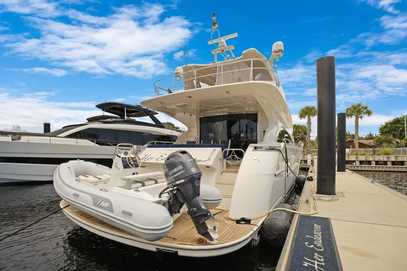 Slide: The Image of Luxury 2008 Marquis 690 yacht docked with inflatable boat and Yamaha motor. - 3