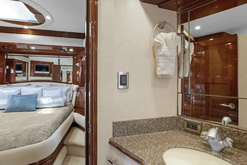 Slide: The Image of Luxurious 2008 Marquis 690 yacht interior with elegant bedroom and bathroom design. - 36