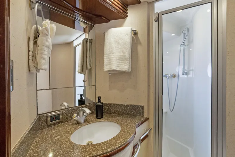 Slide: The Image of Luxurious bathroom in 2008 Marquis 690 yacht with granite countertop and modern shower. - 37