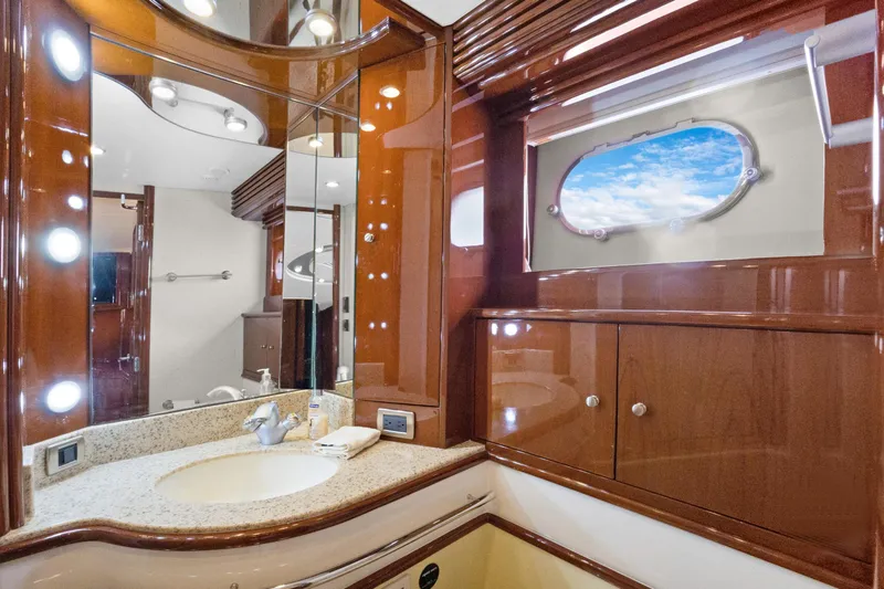 Slide: The Image of Luxurious 2008 Marquis 690 yacht bathroom with elegant wood finish and ocean view. - 38
