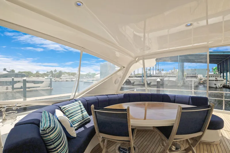 Slide: The Image of Luxurious 2008 Marquis 690 yacht interior with elegant seating and marina view. - 46