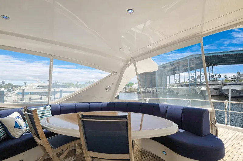Slide: The Image of Luxurious 2008 Marquis 690 yacht interior with elegant seating and marina view. - 47