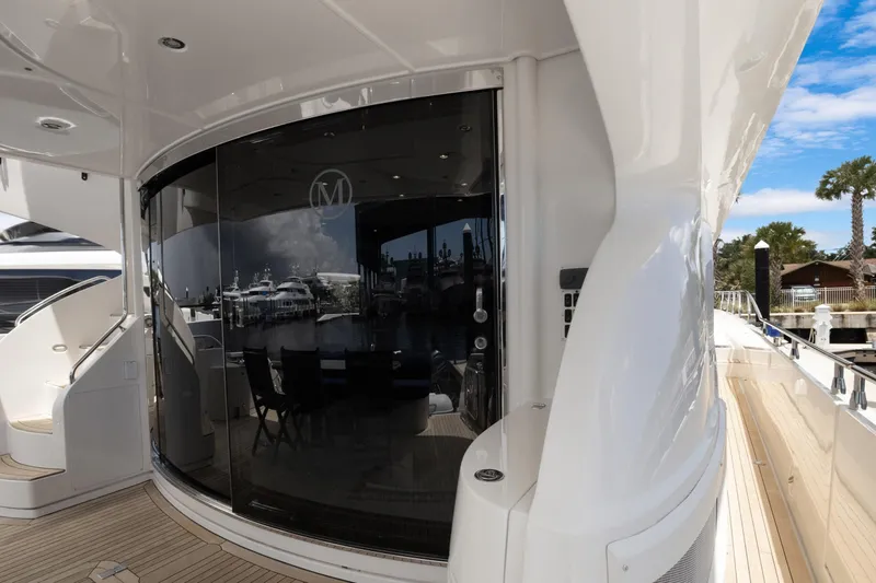 Slide: The Image of Luxury Marquis 690 yacht exterior with sleek design, docked at marina, 2008 model. - 5