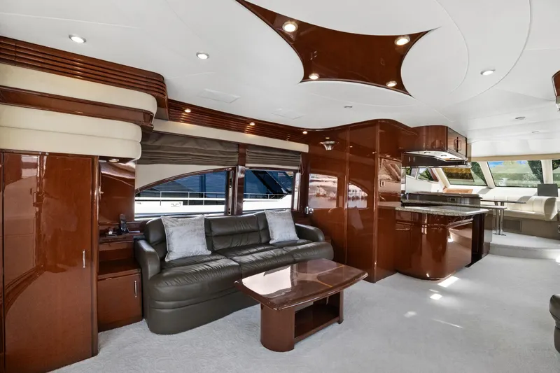 Slide: The Image of Luxurious interior of a 2008 Marquis 690 yacht with elegant wood finishes and modern furnishings. - 9