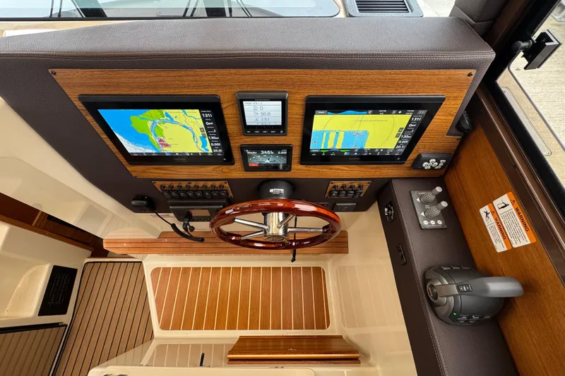 Slide: The Image of Volvo Penta engine display on 2024 Ranger Tugs R-29 S, showing RPM and temperature. - 10