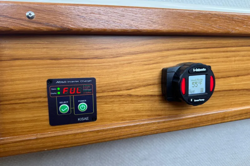 Slide: The Image of 2024 Ranger Tugs R-29 S interior storage area with cushions and accessories. - 18