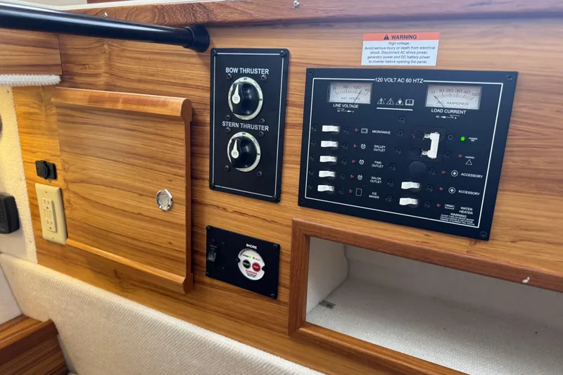 Slide: The Image of Control panel on 2024 Ranger Tugs R-29 S boat with inverter charger and temperature display. - 19