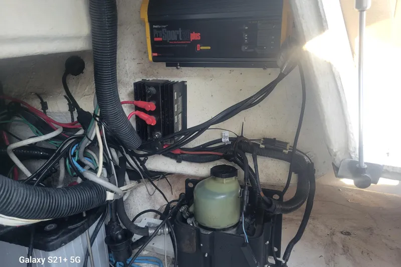 Slide: The Image of Electrical components and wiring inside a 2005 Intrepid 323 Cuddy boat. - 63