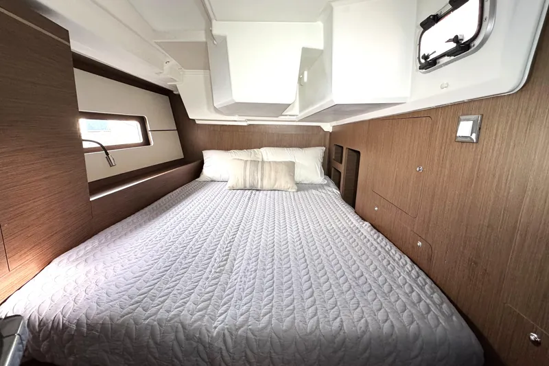 Slide: The Image of Luxurious cabin interior of 2022 Beneteau Oceanis 46.1 yacht with cozy bedding. - 12