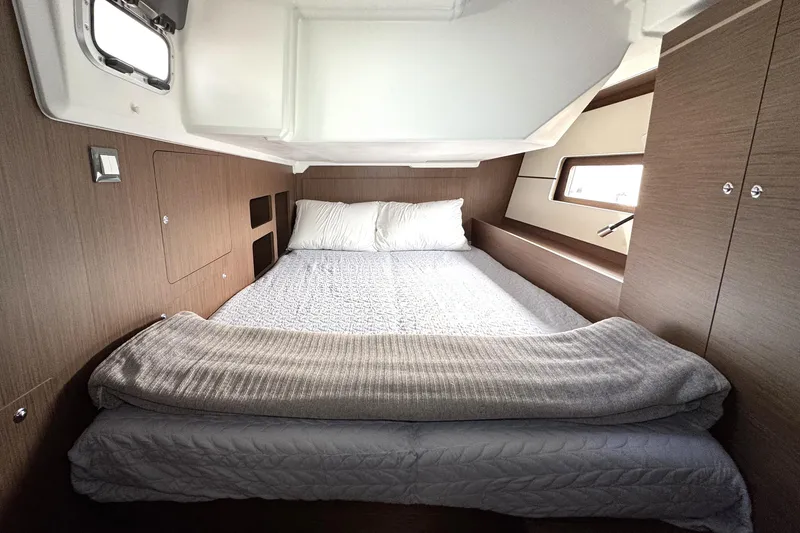 Slide: The Image of Luxurious cabin interior of 2022 Beneteau Oceanis 46.1 yacht with cozy bedding. - 13