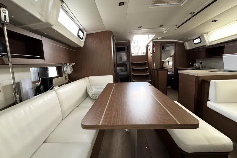 Slide: The Image of Luxurious interior of 2022 Beneteau Oceanis 46.1 yacht with modern wood and white furnishings. - 15