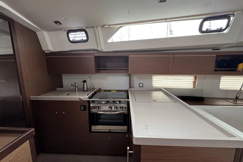 Slide: The Image of Modern kitchen interior of 2022 Beneteau Oceanis 46.1 yacht with sleek cabinetry and appliances. - 18