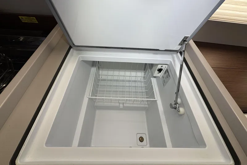 Slide: The Image of Open refrigerator compartment in 2022 Beneteau Oceanis 46.1 yacht kitchen. - 21