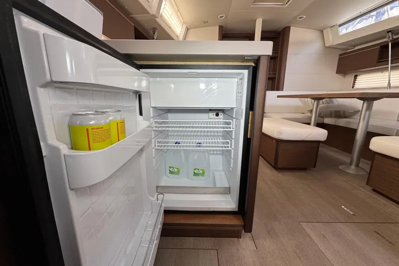 Slide: The Image of Open fridge in 2022 Beneteau Oceanis 46.1 yacht interior, showcasing modern design and amenities. - 22