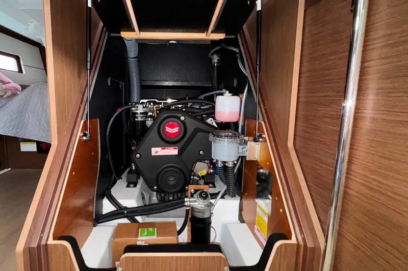 Slide: The Image of Engine compartment of 2022 Beneteau Oceanis 46.1 sailboat, showcasing mechanical components. - 23