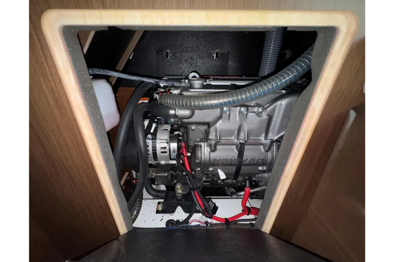 Slide: The Image of Engine compartment of 2022 Beneteau Oceanis 46.1 sailboat, showcasing Yanmar engine. - 26