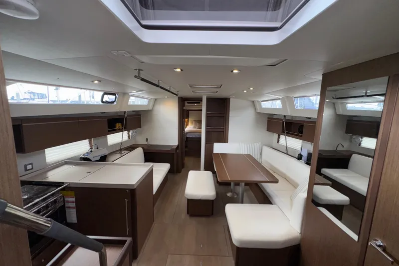 Slide: The Image of Luxurious interior of 2022 Beneteau Oceanis 46.1 yacht with modern furnishings and ample seating. - 3