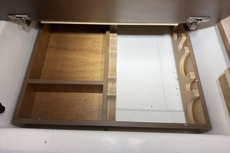 Slide: The Image of Wooden drawer with compartments in a 2022 Beneteau Oceanis 46.1 yacht. - 33