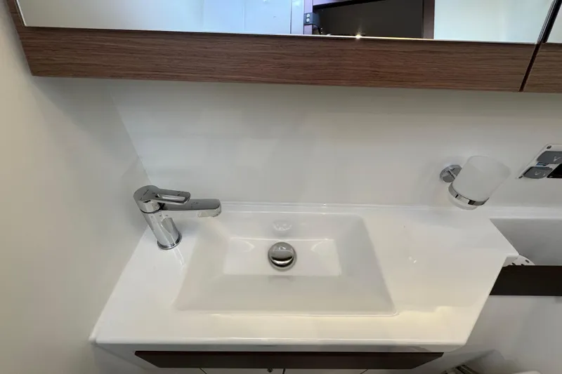 Slide: The Image of Modern bathroom sink in 2022 Beneteau Oceanis 46.1 yacht, featuring sleek faucet design. - 36