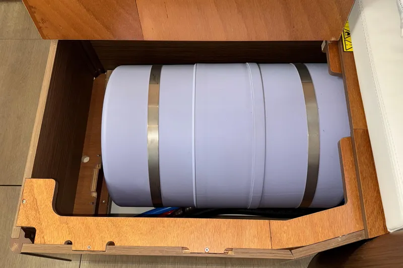 Slide: The Image of Storage compartment on a 2022 Beneteau Oceanis 46.1 yacht, featuring a cylindrical tank. - 40