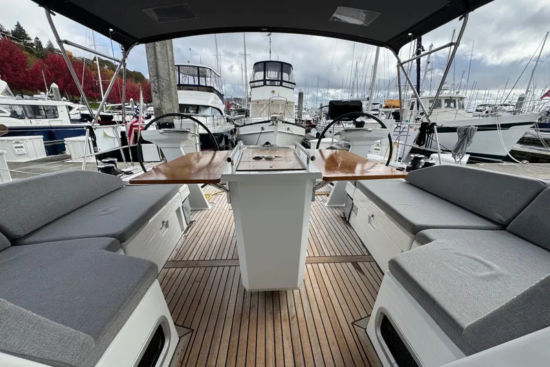 Slide: The Image of Beneteau Oceanis 46.1 yacht cockpit, 2022 model, featuring spacious seating and dual steering wheels. - 44