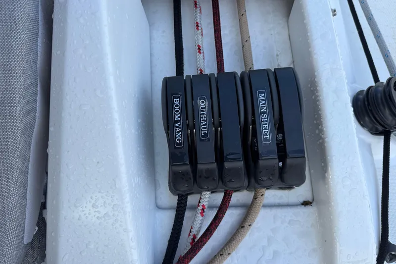 Slide: The Image of Control lines on a 2022 Beneteau Oceanis 46.1 sailboat, labeled boom vang, outhaul, and main sheet. - 48
