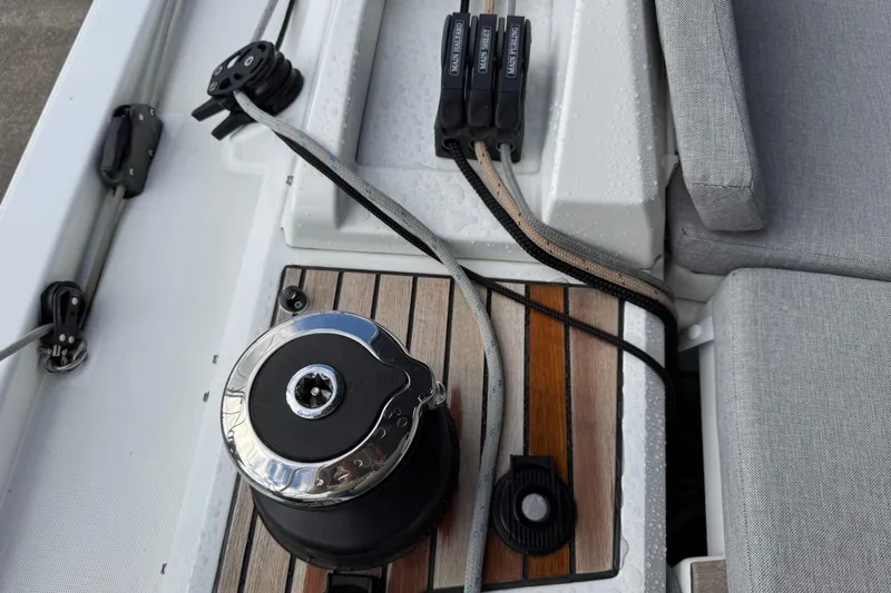 Slide: The Image of Deck view of 2022 Beneteau Oceanis 46.1 sailboat with winch and ropes. - 49