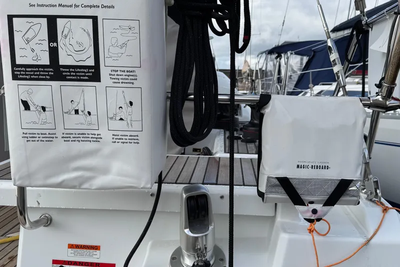 Slide: The Image of Beneteau Oceanis 46.1 yacht with emergency ladder and safety instructions, 2022 model. - 52