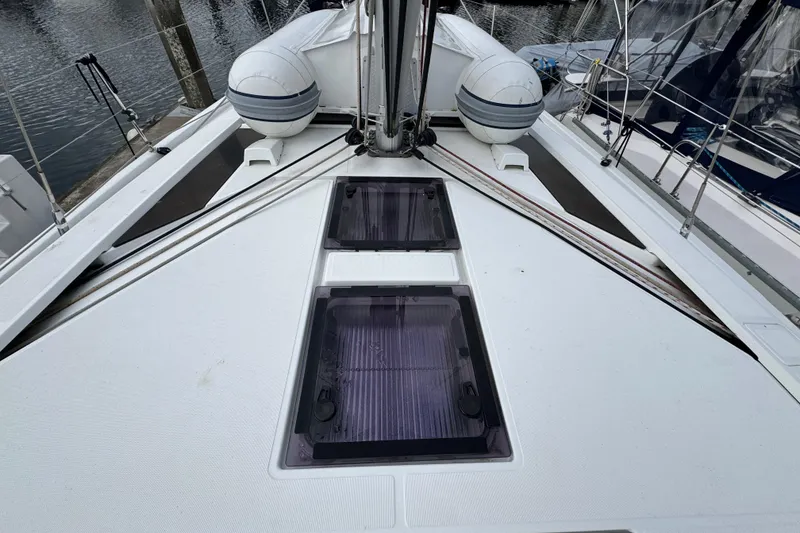 Slide: The Image of Deck view of 2022 Beneteau Oceanis 46.1 sailboat with hatches and lifeboats. - 55